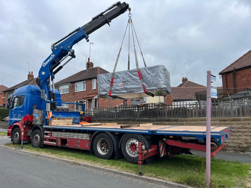 Hiab truck lifting heavy materials in London